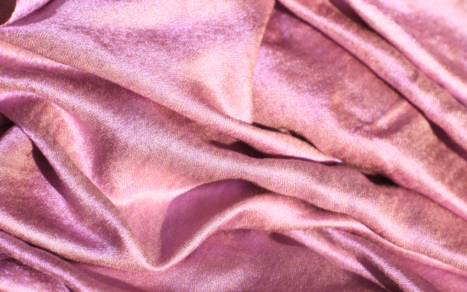 A pink textile laying ruffled up